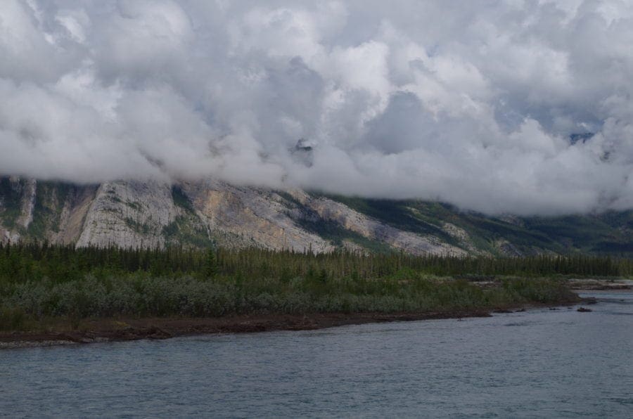 View Of Medicine Lake, Trees, Mountains, And Clouds