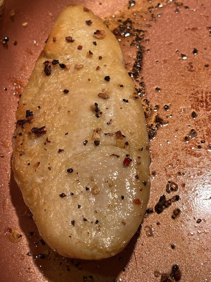 Swap chicken cooking in skillet